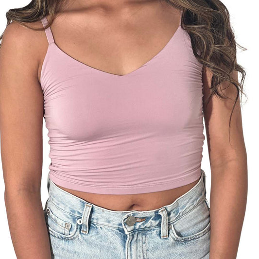The model is wearing a light purple crop cami top from CLOECO. The material is plant-based and skin-safe. It's lightweight and luxiouriously soft.