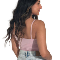The model is wearing a light purple crop cami top from CLOECO. The material is plant-based and skin-safe. It's lightweight and luxiouriously soft.
