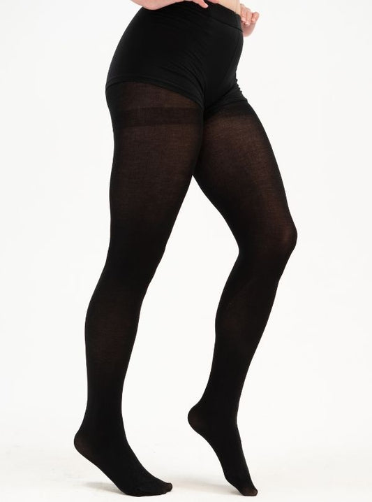 The woman is wearing a pair of comfortable black tights from CLOECO brand. It was made with Tencel material which is plant-based and eco-friendly. Durable, lightweight, and stretchy.