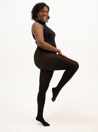The standing woman in all black is wearing Cloeco's skin-friendly black EverTights. Super breathable, soft, and skin-safe.